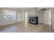 Spacious living room featuring tile floors, fireplace and large windows for natural light at 2333 E Southern Ave # 1023, Tempe, AZ 85282