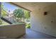 Covered patio with stucco and concrete overlooking the community green space and staircase at 2333 E Southern Ave # 1023, Tempe, AZ 85282