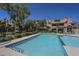 Community pool surrounded by buildings, offering a refreshing amenity for residents at 2333 E Southern Ave # 1023, Tempe, AZ 85282