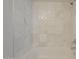 Close up of white marble tiled shower and tub with chrome fixtures in a bright bathroom at 2333 E Southern Ave # 1023, Tempe, AZ 85282