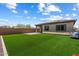 Spacious backyard with artificial grass, ideal for recreation and low maintenance living at 2753 E Fossil Ridge Rd, Phoenix, AZ 85050