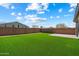 Lush backyard features artificial turf and a brick wall, offering privacy and a green space at 2753 E Fossil Ridge Rd, Phoenix, AZ 85050