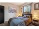 Cozy bedroom with a comfortable bed, decorative pillows, and natural light from the window at 2753 E Fossil Ridge Rd, Phoenix, AZ 85050