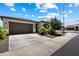 Charming single-story home featuring a two-car garage, desert landscaping, and a welcoming facade at 2753 E Fossil Ridge Rd, Phoenix, AZ 85050