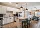 Bright kitchen featuring modern appliances, a central island with seating, and adjacent dining area at 2753 E Fossil Ridge Rd, Phoenix, AZ 85050