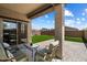 Covered patio with comfortable seating, perfect for outdoor relaxation and enjoying the backyard view at 2753 E Fossil Ridge Rd, Phoenix, AZ 85050