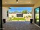 Covered patio overlooking backyard with lush landscaping, providing a private outdoor oasis at 3021 N 47Th St, Phoenix, AZ 85018