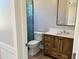 Bathroom featuring stylish vanity with ample storage, tiled walk-in shower and modern fixtures at 3021 N 47Th St, Phoenix, AZ 85018