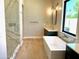 Bathroom featuring a standalone soaking tub, walk-in shower and vanity at 3021 N 47Th St, Phoenix, AZ 85018