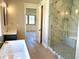 Bathroom featuring walk-in shower and soaking tub with marble surround at 3021 N 47Th St, Phoenix, AZ 85018