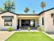 Rear exterior showcasing a manicured lawn and stylish facade, perfect for outdoor living at 3021 N 47Th St, Phoenix, AZ 85018