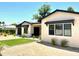 Inviting single-story home with desert landscaping, and manicured lawn at 3021 N 47Th St, Phoenix, AZ 85018