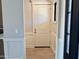 Elegant foyer featuring hardwood floors, wainscoting, and views of the front entrance and adjacent rooms at 3021 N 47Th St, Phoenix, AZ 85018