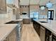 Gourmet kitchen boasts stainless steel appliances, stone countertops, and custom cabinetry at 3021 N 47Th St, Phoenix, AZ 85018