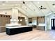 The gourmet kitchen features stainless steel appliances, custom cabinets, and a large center island at 3021 N 47Th St, Phoenix, AZ 85018