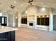 Bright living room features vaulted ceilings, fireplace, custom built-ins, and beautiful wood floors at 3021 N 47Th St, Phoenix, AZ 85018