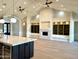 Open-concept living room with fireplace, built-in shelving, and views into modern kitchen at 3021 N 47Th St, Phoenix, AZ 85018