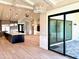 Open-concept living area with views of the kitchen and sliding glass door to the backyard at 3021 N 47Th St, Phoenix, AZ 85018