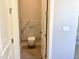 Powder room with marble accent wall and floating toilet at 3021 N 47Th St, Phoenix, AZ 85018
