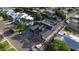 Spacious newly constructed home showcases modern design with a dark roof amidst lush green surroundings and neighborhood streets at 3028 N 47Th St, Phoenix, AZ 85018