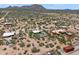 Panoramic aerial view of desert community with custom homes, mountain views, native landscaping, and private pools at 31825 N 141St St, Scottsdale, AZ 85262