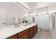 Elegant bathroom boasts dual sinks and ample counter space, blending style and functionality at 31825 N 141St St, Scottsdale, AZ 85262