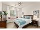 Comfortable bedroom features a bright window nook, creating a cozy and inviting atmosphere at 31825 N 141St St, Scottsdale, AZ 85262