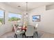Cozy dining room with a round table, large window and stunning desert views at 31825 N 141St St, Scottsdale, AZ 85262