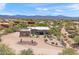 Desert home with native landscaping featuring cacti and mountain views under a partly cloudy sky at 31825 N 141St St, Scottsdale, AZ 85262