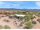 Desert home surrounded by local flora on a clear day, with native cacti and plantings in the yard at 31825 N 141St St, Scottsdale, AZ 85262
