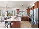 Modern kitchen with stainless steel appliances and a spacious island, ideal for cooking and entertaining at 31825 N 141St St, Scottsdale, AZ 85262
