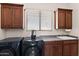 Well-lit laundry room featuring modern appliances and ample cabinet space for storage, perfect for convenient chores at 31825 N 141St St, Scottsdale, AZ 85262