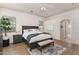Serene main bedroom with natural light, ceiling fan, and ensuite bathroom entrance at 31825 N 141St St, Scottsdale, AZ 85262