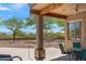 Relaxing covered patio area with views of desert landscape, mountain scenery, and a refreshing pool with spa at 31825 N 141St St, Scottsdale, AZ 85262