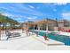 Beautiful backyard featuring a pool, spa, lounge chairs and desert landscaping, ideal for outdoor entertaining and relaxation at 31825 N 141St St, Scottsdale, AZ 85262