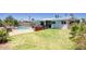 Expansive backyard featuring a grassy lawn, barbecue area, shaded patio, and a fenced pool area perfect for outdoor entertaining at 3203 W Libby St, Phoenix, AZ 85053