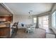 Cozy dining area adjacent to the kitchen with natural light and comfortable seating at 3203 W Libby St, Phoenix, AZ 85053