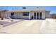 Welcoming single-story home with a spacious driveway leading to a convenient attached garage at 3203 W Libby St, Phoenix, AZ 85053