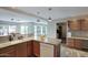 Open kitchen with an island, breakfast bar, and modern appliances for culinary enthusiasts at 3203 W Libby St, Phoenix, AZ 85053