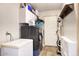 Functional laundry room with modern washer and dryer, storage, and convenient access at 3203 W Libby St, Phoenix, AZ 85053
