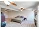 Spacious main bedroom with ceiling fan, neutral carpet, and good natural light at 3203 W Libby St, Phoenix, AZ 85053