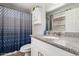 Updated bathroom with granite countertops, a modern vanity, and a stylish shower curtain at 3438 S Bowman Rd, Apache Junction, AZ 85119