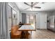 Dining room with a wooden table, bench seating, and a sliding glass door that leads to backyard at 3438 S Bowman Rd, Apache Junction, AZ 85119