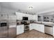 Bright kitchen with stainless steel appliances, granite countertops, and modern white cabinets at 3438 S Bowman Rd, Apache Junction, AZ 85119