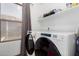Modern laundry room with side-by-side washer and dryer, plus convenient shelving at 3438 S Bowman Rd, Apache Junction, AZ 85119