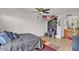 Bedroom featuring a ceiling fan, TV and closet, along with modern flooring and natural light at 3500 N Hayden Rd # 203, Scottsdale, AZ 85251