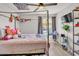 Cozy bedroom with a well-lit window, ceiling fan and a view of the outside, creating a serene atmosphere at 3500 N Hayden Rd # 203, Scottsdale, AZ 85251