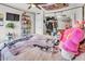 Bedroom showcasing a cozy bed, ceiling fan and a large closet with mirrored doors for ample storage at 3500 N Hayden Rd # 203, Scottsdale, AZ 85251