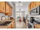 Efficient kitchen featuring stainless-steel appliances and views to living area at 3500 N Hayden Rd # 203, Scottsdale, AZ 85251