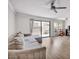Bright living room with sliding glass doors and a comfortable gray sofa at 3500 N Hayden Rd # 203, Scottsdale, AZ 85251
